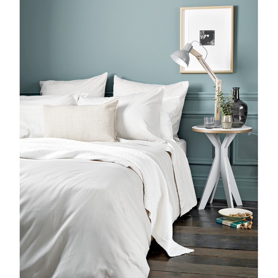 bedroom with wooden flooring and double bed