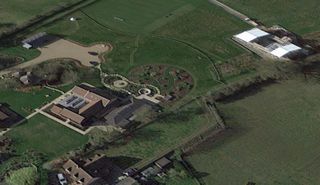 An overhead shot of Ed Sheeran's Suffolk home shows large green plots next to his house