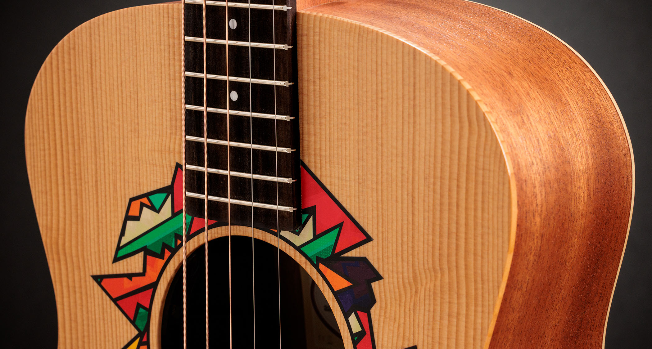Taylor Jacob Collier GS Mini: featuring a brightly-coloured rosette graphic designed with the musical polymath, this beginner friendly acoustic has a bold five-string design for his signature DAEAD tuning.