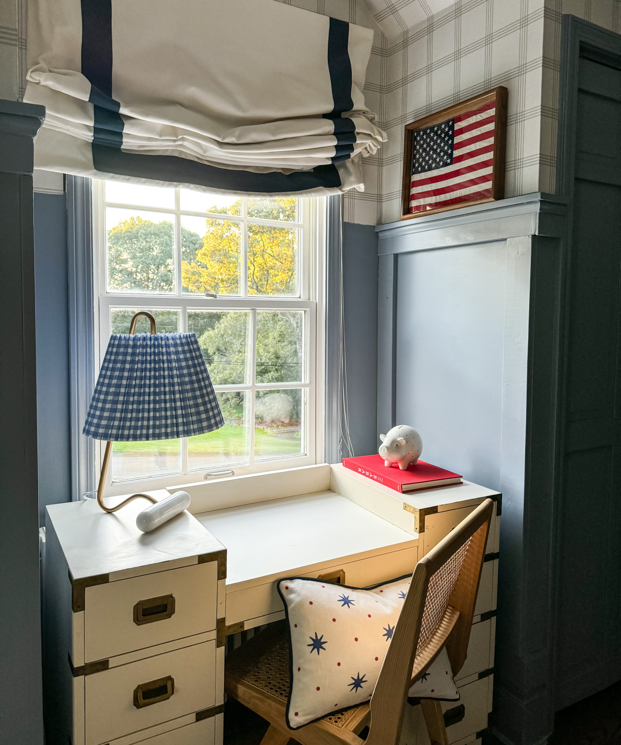 blue kids room with white campaign desk