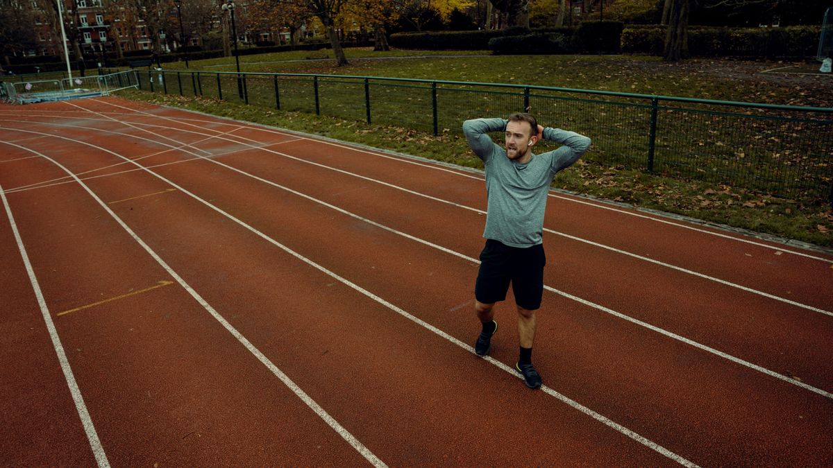 Man stands on running track