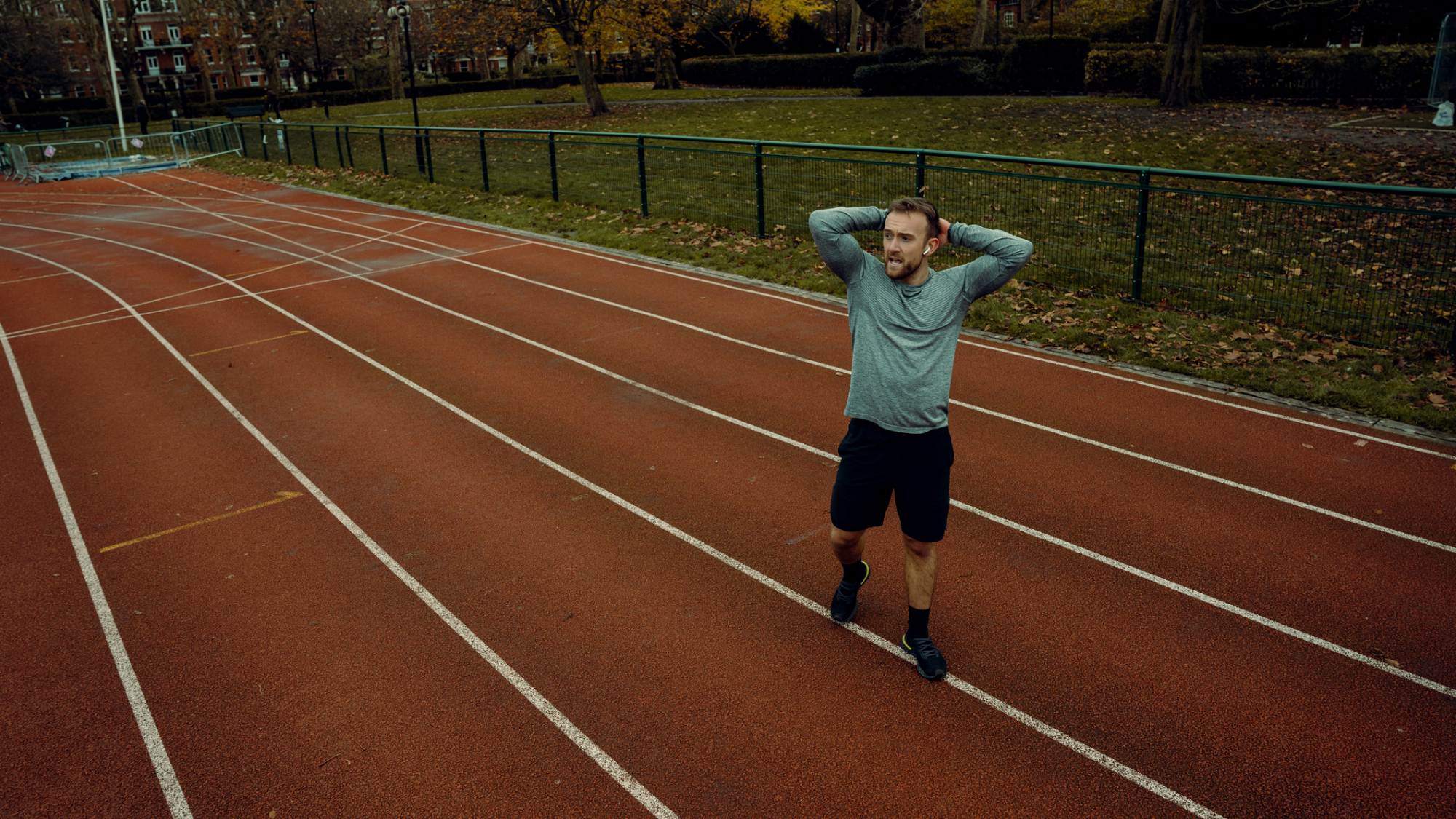 Man stands on running track