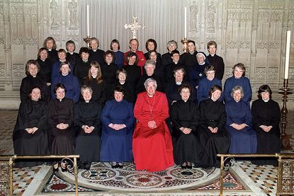 Anglican Bishop Barry Rogerson of Bristol posing with the first women to be ordained priests in the Church of England