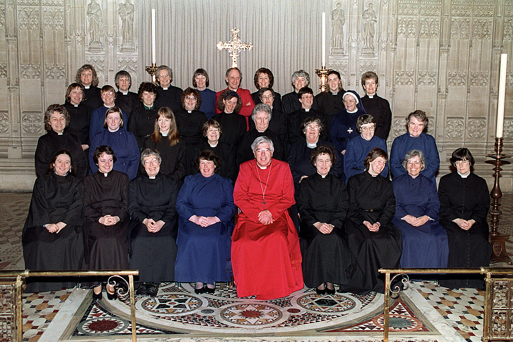 Anglican Bishop Barry Rogerson of Bristol posing with the first women to be ordained priests in the Church of England