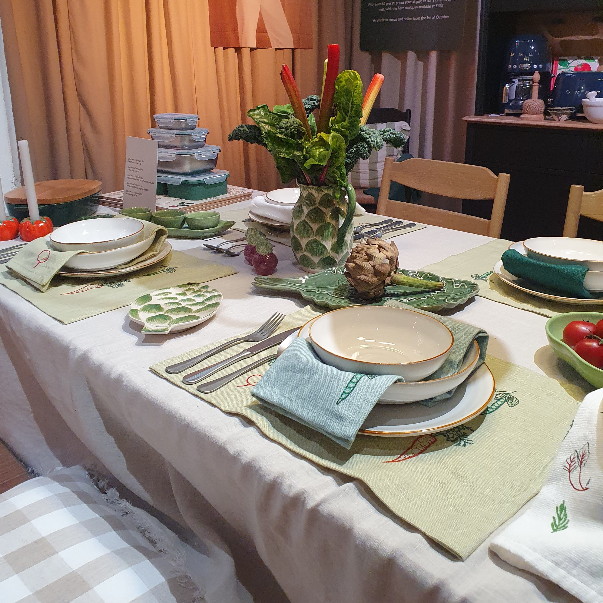 A dining table set with pieces from the John Lewis x Deliciously Ella collaboration at the autumn/winter 2025 press preview