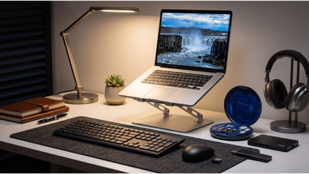 A selection of essential budget tech on a desk in a home office