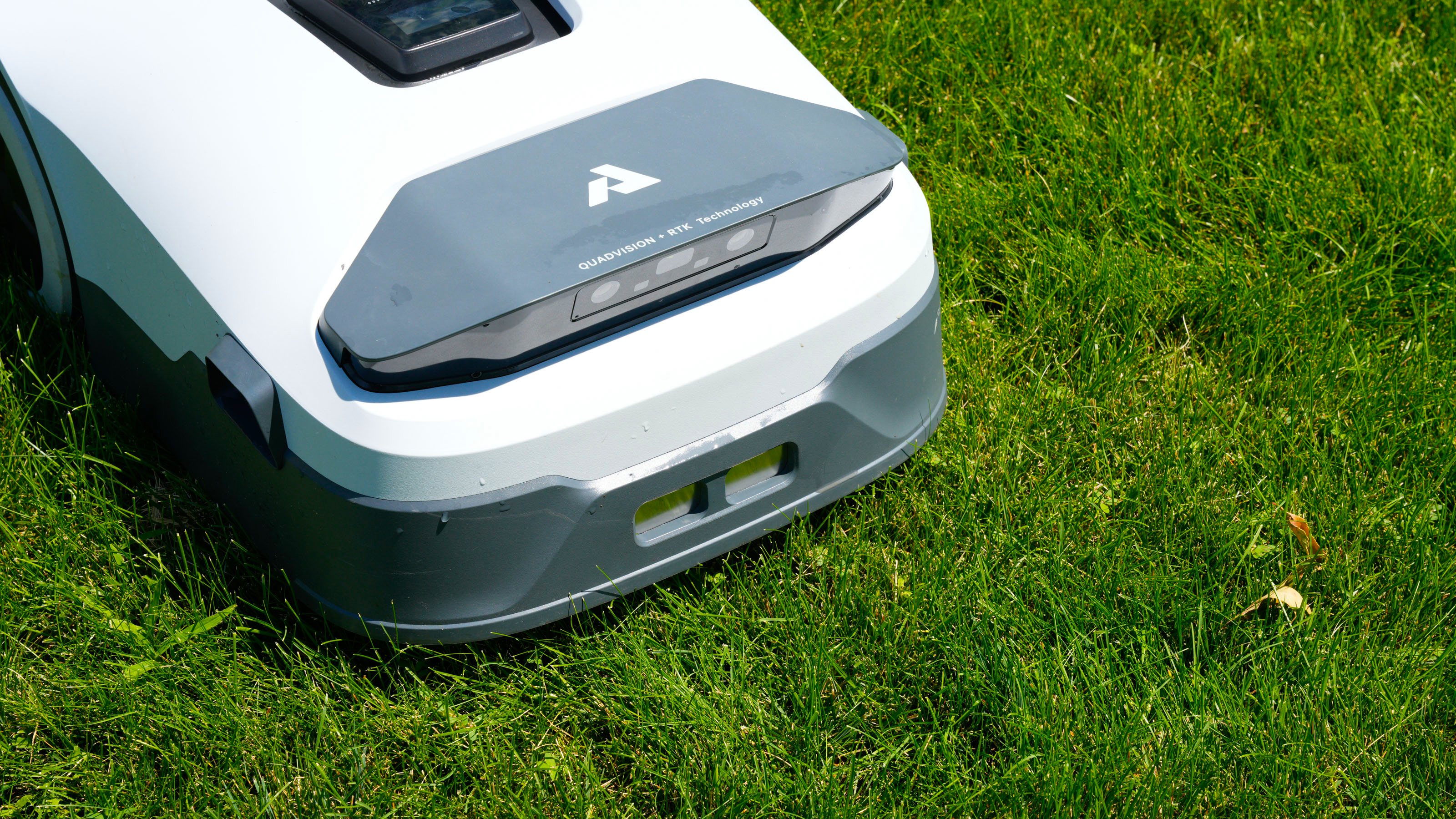 Anthbot Genie 3000 being tested in a bright green yard
