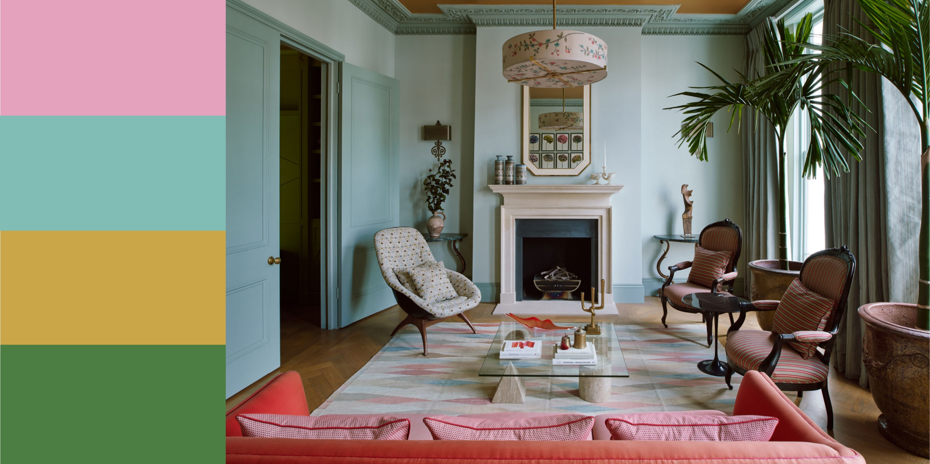 a living room with blue walls, pink couch, gold ceiling and large palm plants