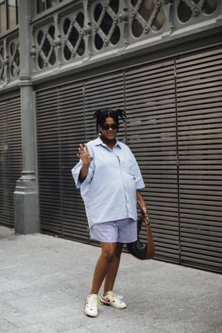 woman wearing linen shirt and shorts