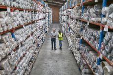 Workers in a carpet warehouse similar to those operated by Likewise Group