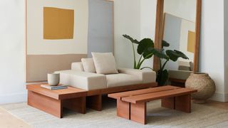 Japandi styled living room with futon-inspired cuddler chair with built in coffee table