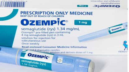 still life shot of a pack of Ozempic with the injector pen in the foreground