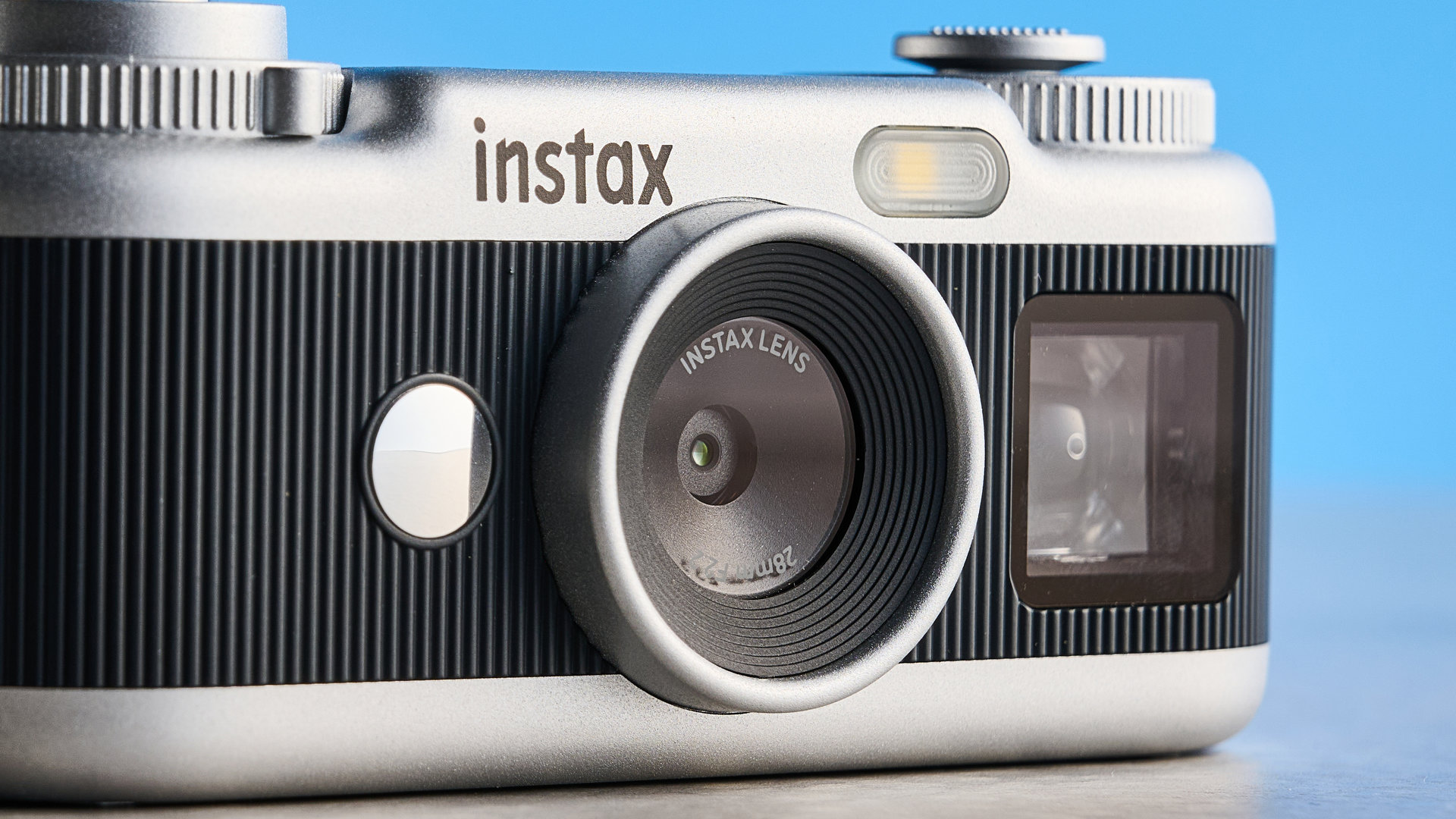 A black and silver Fujifilm Instax Pal 2 digital camera