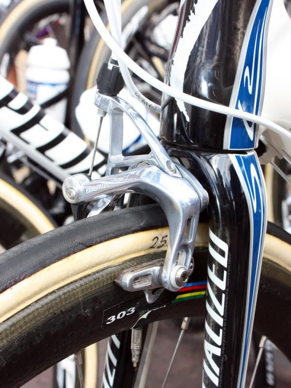 Brake pads slid nearly all the way down in the caliper slots provide a good clue as to how much room is beneath the fork crown.