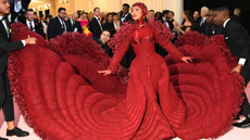 Cardi B wears a voluminous dark red Moschino gown to the 2019 Met Gala