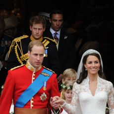 Britain's Prince Harry (Background C) leaves Westminster Abbey in London, after the wedding ceremony of his brother Prince William (Front L) and Kate, (Front R) Duchess of Cambridge, on April 29, 2011.