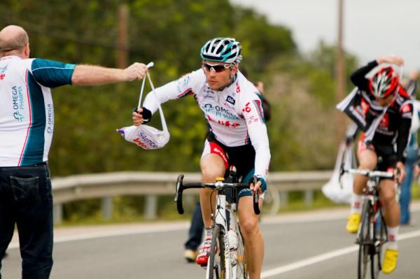 An Omega Pharma-Lotto rider catching his lunch.