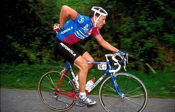 Lance Armstrong puts his shades in his back pocket to get to work.