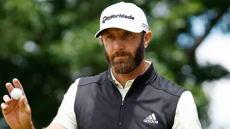 Dustin Johnson walks off the green after making a birdie in the third round of the 2022 US Open