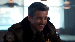 Patrick Dempsey laughs at a diner counter in uniform in Thanksgiving.