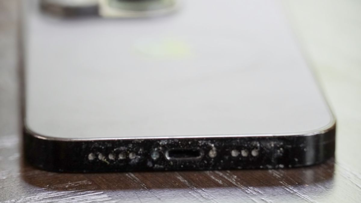 The bottom of my dad's iPhone 14 Pro before using the Otterbox Mobile Device Care Kit.