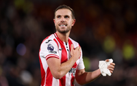 Jordan Henderson of Brentford celebrates following his side's victory in the Premier League match between Brentford and Liverpool at Gtech Community Stadium on October 25, 2025 in Brentford, England.