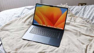 An Apple MacBook Air 15 M2 (2023) on a bed, one of the best photo-editing laptops
