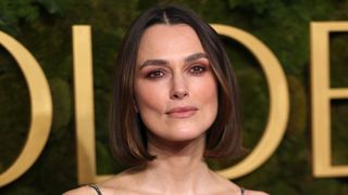 Keira Knightley is pictured with a tousled bob hairstyle and wearing warm rosy-brown eye makeup at the 82nd Annual Golden Globe Awards at The Beverly Hilton on January 05, 2025 in Beverly Hills, California.