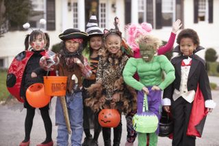 A group of children dressed up for Halloween