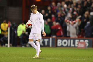 A dejected Martin Odegaard of Arsenal after Lewis Grabban of Nottingham Forest scored a goal to make it 1-0 during the Emirates FA Cup Third Round match between Nottingham Forest and Arsenal at City Ground on January 9, 2022 in Nottingham, England.