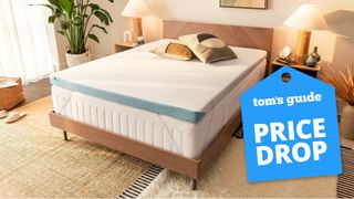 The Tempur-Pedic Tempur-Adapt Topper on a mattress in a bedroom, a Tom's Guide price drop deals graphic (right)