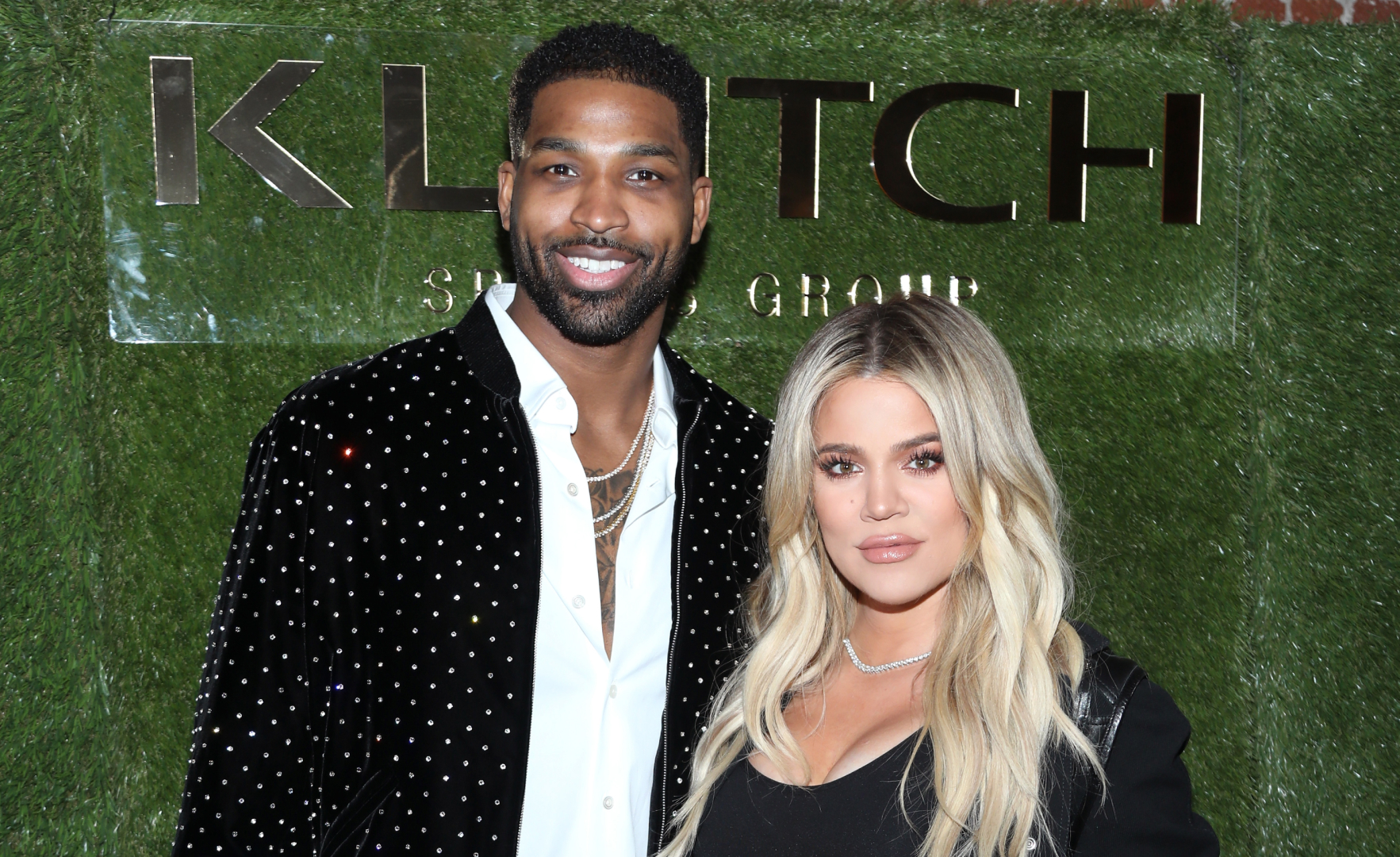 Tristan Thompson in a white shirt and black embellished jacket and Khloe Kardashian in black dress and black coat attend the Klutch Sports Group "More Than A Game" Dinner Presented by Remy Martin at Beauty &amp; Essex on February 17, 2018 in Los Angeles, California