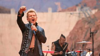 Billy Idol singing in front of the Hoover Dam