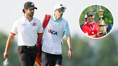 Jose Luis Ballester walks down the fairway with his caddie, while holding the US Amateur trophy