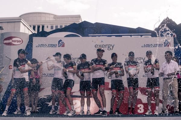 RadioShack-Nissan celebrates on the podium after winning the team classification.