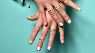 Woman's hands wearing stacked rings