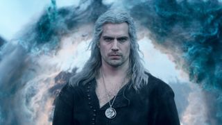 Henry Cavill as Geralt of Rivia in The Witcher season 3, with a cloud of smoke behind him