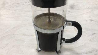 Moccamaster grinder grounds in a French press