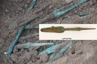 Hundreds of bronze spearheads were found buried in the ancient Mesopotamian tomb holding the remains of two 12-year-olds (a male and female).