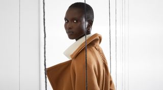 The Modern Artisan lookbook images, featuring a female model in a brown jacket