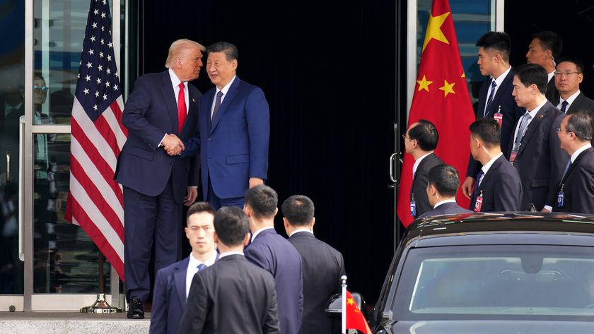 Donald Trump whispers in Xi Jinping&#039;s ear following the conclusion of trade talks in Southeast Asia. 