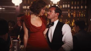 Emma Mackey and Armie Hammer getting close at the bar in Death on the Nile.