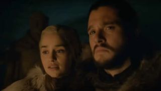 Emilia Clarke as Daenerys Targaryen and Kit Harington as Jon Snow watching the firelight on Game of Thrones