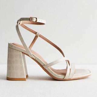 flat lay of strappy heeled sandals