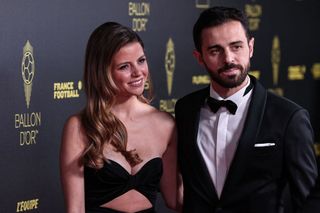 Influencer Ines Tomaz (L) and her husband Manchester City Portuguese midfielder Bernardo Silva (R) pose prior to the 2023 Ballon d'Or France Football award ceremony at the Theatre du Chatelet in Paris on October 30, 2023.