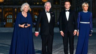 Queen Camilla and King Charles III are welcomed by French President Emmanuel Macron and Brigitte Macron prior to a state dinner