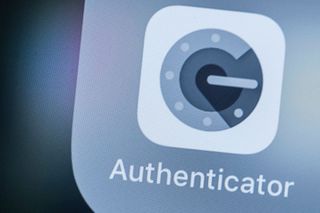 Google Authenticator logo, which is a grey 'G' stylized to look like a tumbler lock