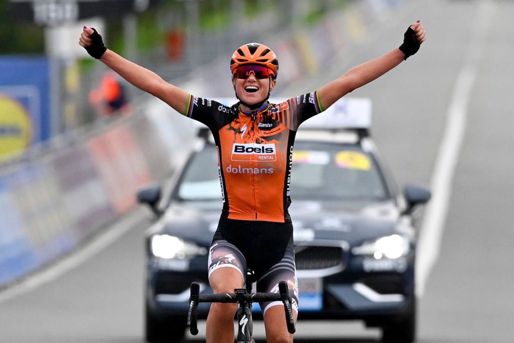 Chantal Van den BroekBlaak celebrates as she crosses the finish line to win...
