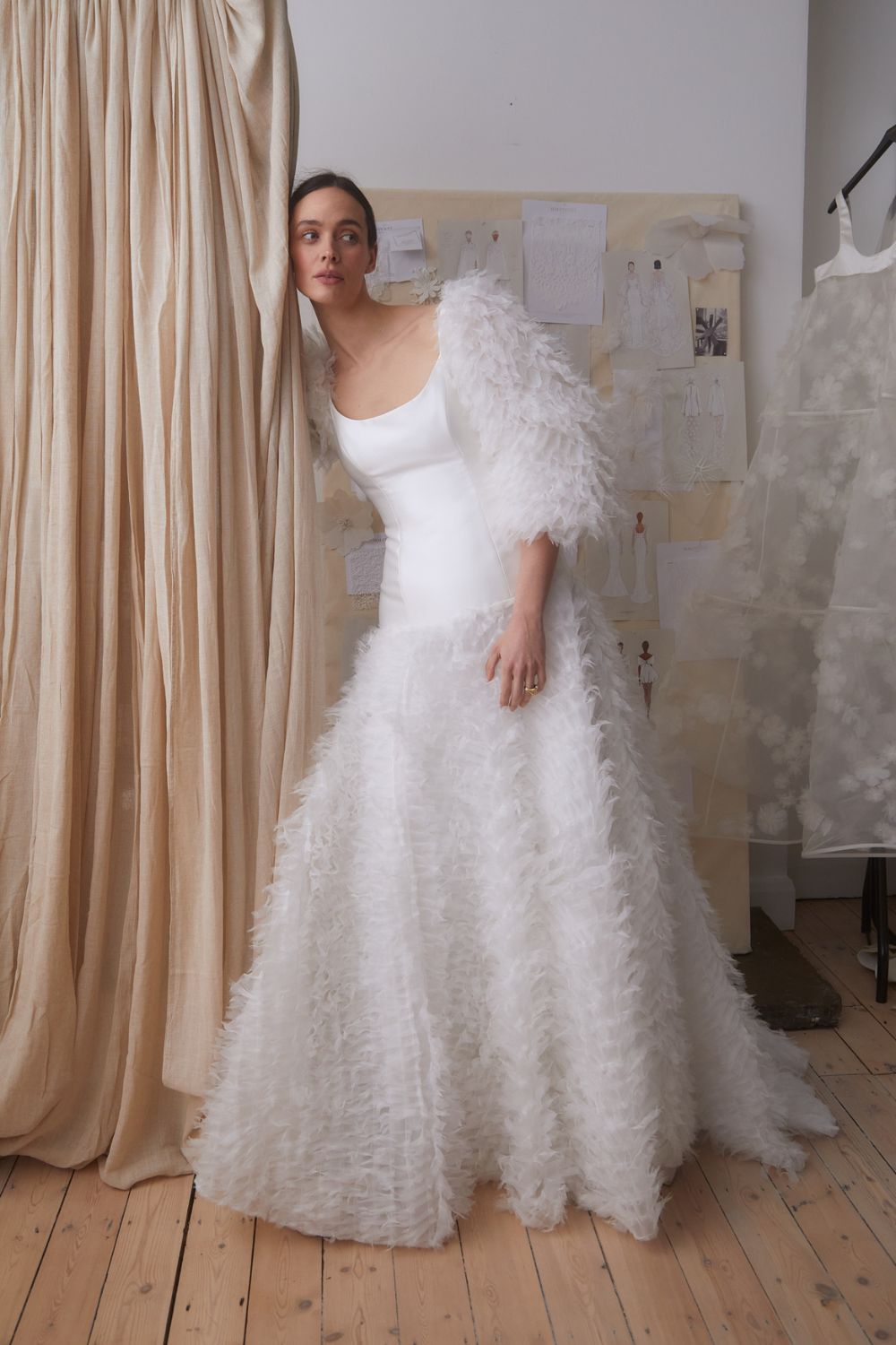 a model wearing halfpenny london wedding dress