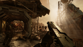 A screenshot of Warhammer 40,000: Darktide where the player is shooting a crowd of enemies.